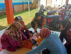 Anggota Koramil 1407-13/Sibulue Aktif Laksanakan Pendampingan Posyandu Di Desa Tadang Palie